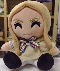 lot 402 image: Megan plush toy with bow. GS80
