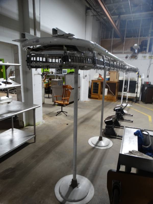 lot 14203 image: Line master executive dry cleaning spinner rack. 24ft long.