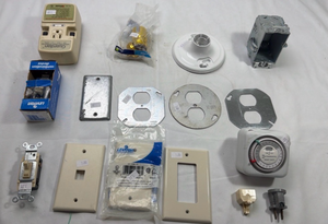lot 252 image: Electrical Supplies Bundle - Switch Plates, Timer and GFCI