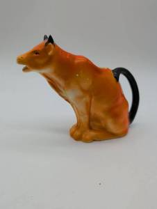lot 11132 image: Antique Orange Cow Creamer Pitcher