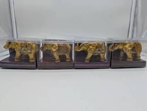 lot 11166 image: Decorative Gold Elephant Figurines, set of 4 in original packaging