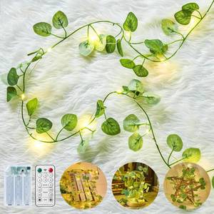 lot 2232 image: Minetom Vine Fairy Lights Battery Operated 21ft 60 LED Green Eucalyptus Garland Light with Remote Control - Hanging Leaf String Lights for Girls Bedroom Dorm Room Wall Decorations