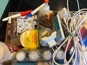 lot 1057 image: Flat of Miscellaneous (Light Bulbs, Tape, Phone Chargers, Glue & More)--K
