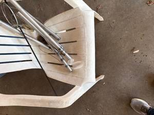 lot 1419 image: Wind Chimes & Plastic Patio Chair  -- Gar