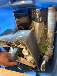 lot 1422 image: Tote of Plumbing Supplies -- Gar