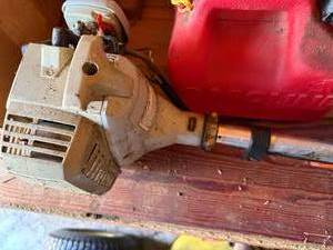 lot 1328 image: Echo Weed Eater & Fuel Can--Shed
