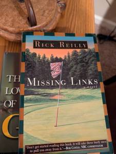 lot 2567 image: The Missing Links by Rick Reilly - Golf Novel- gold book lot