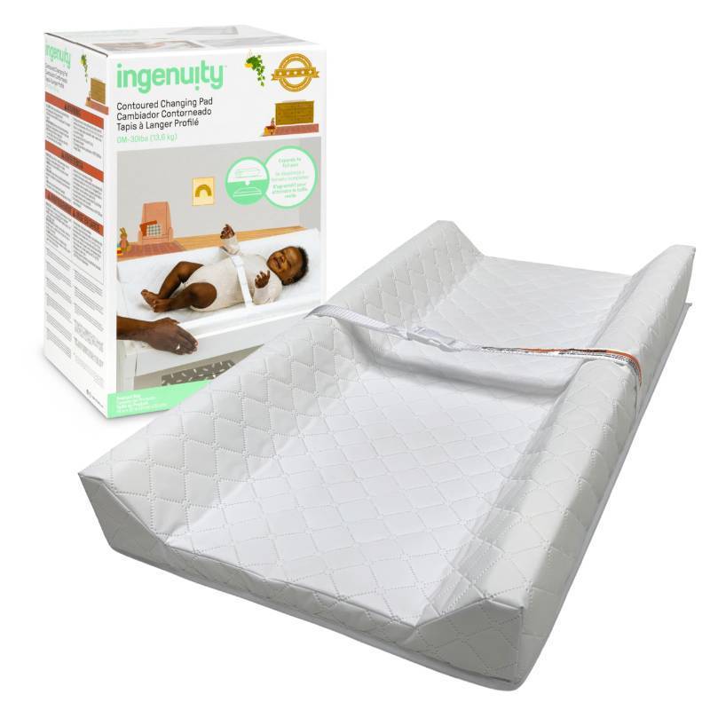 lot 54883 image: Ingenuity Contoured Changing Pad Includes Waterproof Changing Liner and Safety Fastening Strap with Quick-Release Buckle - Retail $19