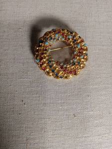 lot 1289 image: Gold Tone Crescent Brooch with Multicolor Stones