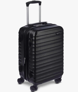 lot 3253 image: (One of the wheels is very damaged) Amazon Basics hard shell large suitcase  - Retail $35