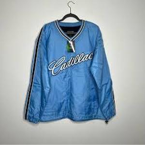 lot 25181 image: blue pullover jacket is a Steve & Barrys Cadillac V-neck windbreaker - XXL
