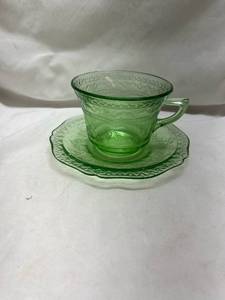 lot 234 image: Green Depression Uranium Glass Tea Cup and Saucer Set