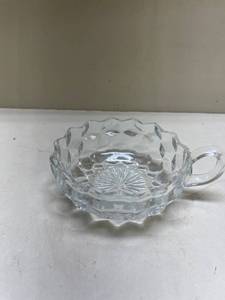 lot 240 image: Clear Glass Cubist Pattern Nappy Dish with Handle Glows with Magnesium under UV 365nm