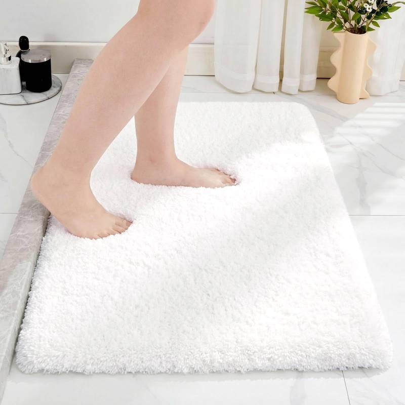 lot 25751 image: Disolla White Bathroom Rug 20x32 Non Slip Fluffy Bath Mat for Bathroom Floor Washable Plush Luxury Bath Rug for Tub Soft Shaggy Absorbent Shower Sink Mat - Retail $30