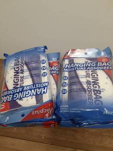 lot 696 image: Nine Pack Hanging Moisture Absorber  - Retail $0