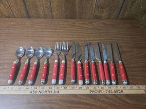 lot 192 image: Red Handle Flatware Set
