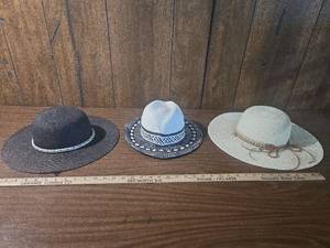lot 207 image: Set of Three Straw Sun Hats with Decorative Bands