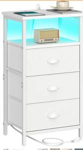 lot 7579 image: Nightstand with Charging Station,LED White Nightstand with 3 Fabric Drawers PU Finish, Bedside End Tables, 2-Tier Open Storage Shelf Side Table Nightstand with Drawers for Bedroom,White