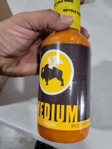 lot 9147 image: Buffalo Wild Wings Medium Wing Sauce Bottle 20oz 6 pack