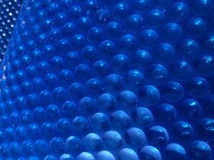 lot 1028 image: BigXwell 18 Foot Round Solar Pool Cover,18-mil Blue Above-Ground and In-Ground Pools Cover, Heavy-Duty Insulating Pool Heater Cover - Retail $220