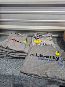 lot 209 image: Liberty and Raymore Urgent Care Staff T-Shirt - New - (2) 2XL (4) XL (5) Med (3) Small - Retail $15