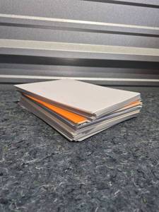 lot 218 image: Mixed Paper Stack Lot - White and Orange - Heavier Than Normal Printer Paper - Retail $15