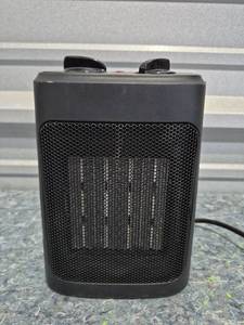 lot 227 image: Compact Ceramic Space Heater with Adjustable Thermostat - Retail $15