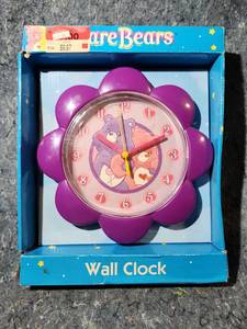lot 280 image: Care Bears Purple Flower Wall Clock