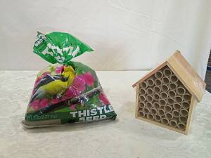lot 70 image: Wooden Bee Bug Hotel with Thistle Bird Seed