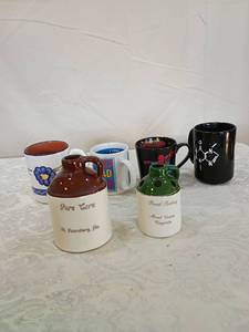 lot 121 image: Decorative Mini Moonshine Jugs - Pure Corn & Pencil Parking and mug set.