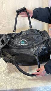 lot 156 image: 1999 Golf On The Rock Member Guest Leather Duffle Bag