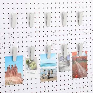 lot 2421 image: CroBlissful 10 Pcs Pegboard Accessories Clips Pegboard Clips Metal Accessories Hook Attachment Peg Board Clip for Crafts Kitchen Bathroom Room Office Wall Organize Storage Display (White)