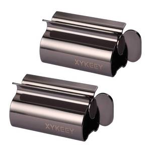 lot 16453 image: XYKEEY Toothpaste Tube Squeezer - Set of 2 Toothpaste Squeezer Rollers, Metal Toothpaste Tube Wringer Seat Holder Stand (Black)