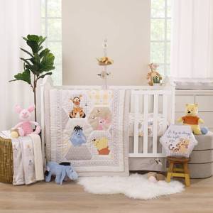 lot 59463 image: Disney Winnie The Pooh Hugs and Honeycombs Grey, White, and Tan Patchwork with Piglet, Tigger and Eeyore 3 Piece Crib Bedding Set - Comforter, 100% Cotton Fitted Crib Sheet, and Crib Skirt - Retail $160