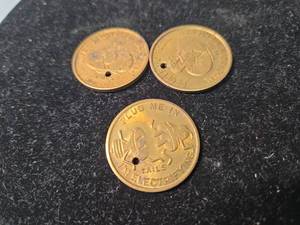 lot 110 image: Plug Me In Gold-Colored Arcade Tokens