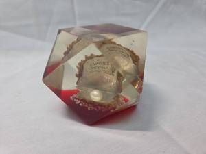 lot 121 image: Red and Clear Lucite Religious Paperweight