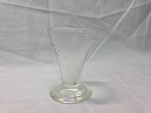 lot 122 image: Frazier Drug Co Glass Measuring Cup