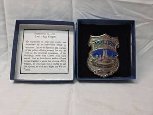 lot 128 image: 911 World Trade Center Police Commemorative Badge Set