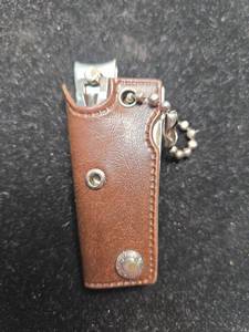 lot 186 image: Miniature Multi-Tool Leather Keychain
