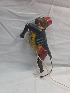 lot 213 image: Vintage C.E. Carter climbing monkey tin toy