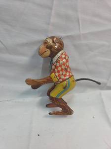 lot 220 image: Wind-up Monkey Toy with Checkered Vest