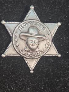 lot 373 image: Hopalong Cassidy Star Badge Pin