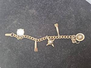 lot 384 image: Gold Tone Charm Bracelet with Rocket Ships