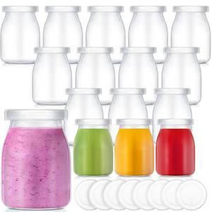lot 15847 image: Zubebe 12 Pack 5 oz Christmas Glass Jars with 24 Lids - Festive & Reusable Small Bottles for Holiday Party Favors, DIY Snow Globes, Puddings, and More - Retail $27