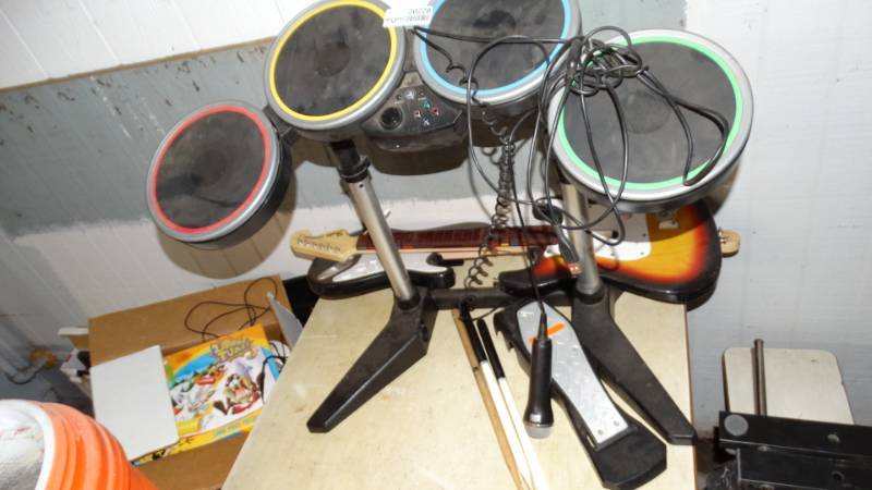 lot 20228 image: Guitar hero drum set and 2 guitars
