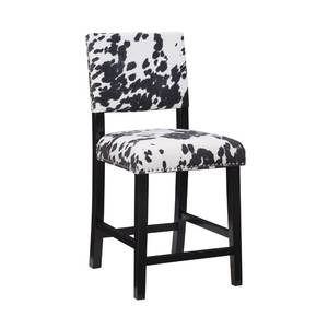 lot 11497 image: Linon Cole Black Wood 24 Seat Height Counter Stool with Black and White Cow Print Upholstered Seat and Back