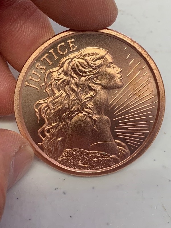 lot 18 image: 1 oz 999 Fine Copper Round Justice Silver Shield design