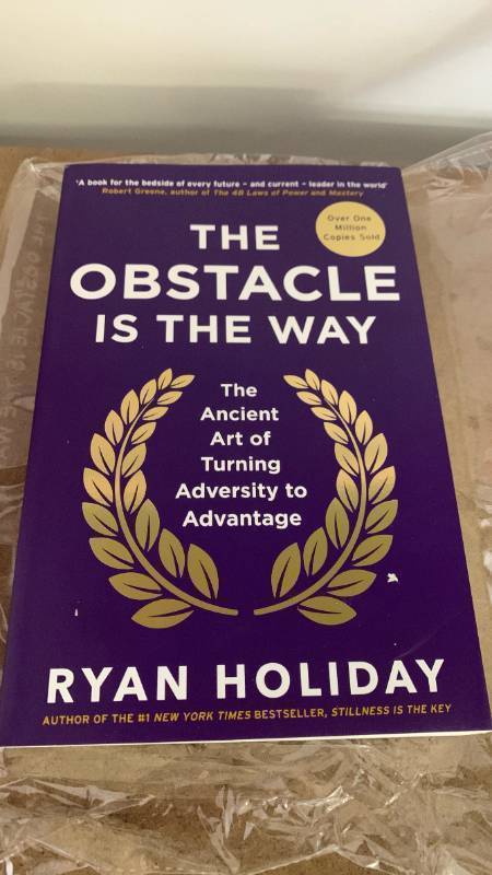 lot 743 image: The Obstacle Is the Way by Ryan Holiday - Self-Help Bestseller paperback book DP60