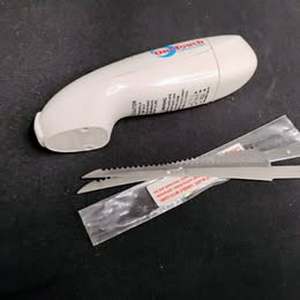 lot 1656 image: OneTouch Cordless Electric Knife with Replacement Blades