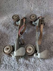 lot 1012 image: 1960s Metal Roller Skates with Leather Straps